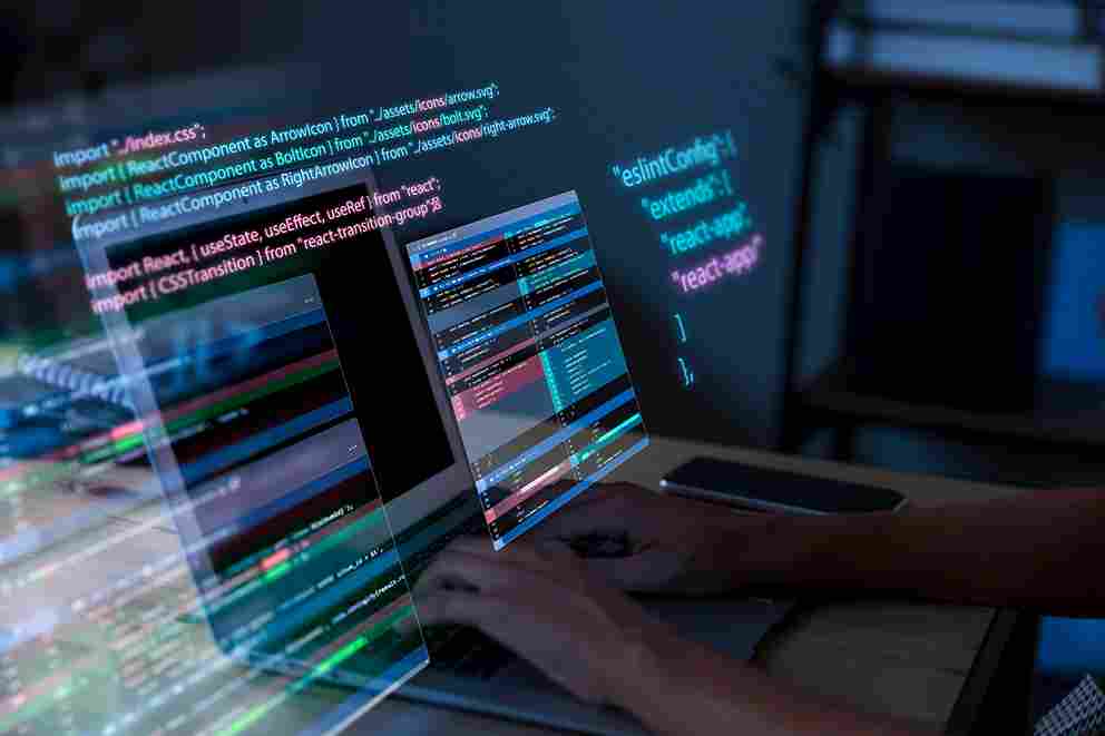 programming-background-with-person-working-with-codes-computer_2_11zon